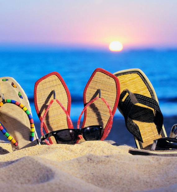 Summer flip flops on the beach